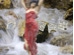 Dancing woman in running water